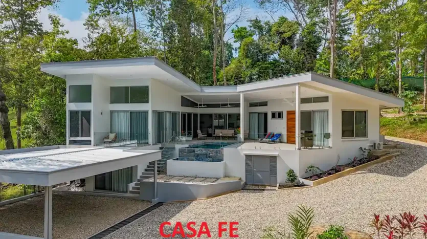 A Unique Rainforest Estate with Two Luxury Homes, River, and Waterfall on 4.93 Acres in Uvita