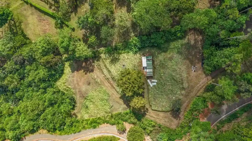 A Unique Rainforest Estate with Two Luxury Homes, River, and Waterfall on 4.93 Acres in Uvita