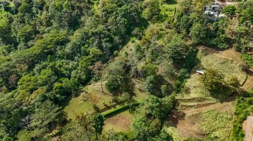A Unique Rainforest Estate with Two Luxury Homes, River, and Waterfall on 4.93 Acres in Uvita
