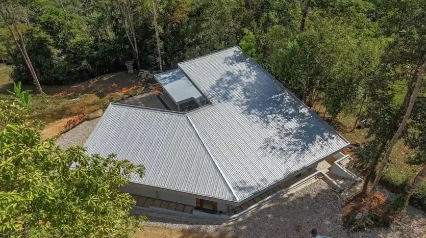 A Unique Rainforest Estate with Two Luxury Homes, River, and Waterfall on 4.93 Acres in Uvita