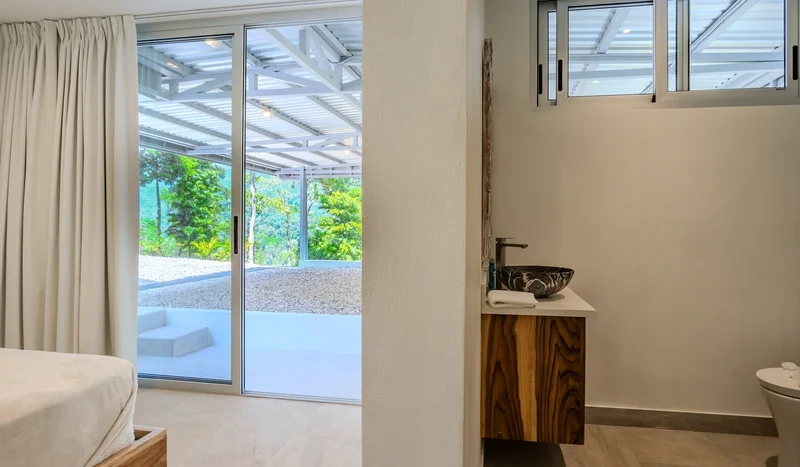 A Unique Rainforest Estate with Two Luxury Homes, River, and Waterfall on 4.93 Acres in Uvita
