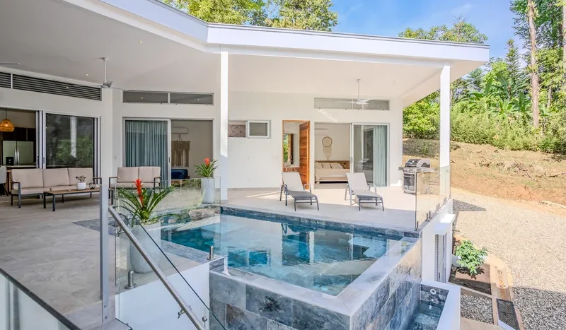 A Unique Rainforest Estate with Two Luxury Homes, River, and Waterfall on 4.93 Acres in Uvita