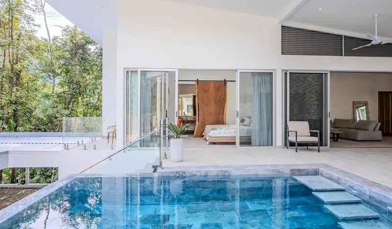 A Unique Rainforest Estate with Two Luxury Homes, River, and Waterfall on 4.93 Acres in Uvita
