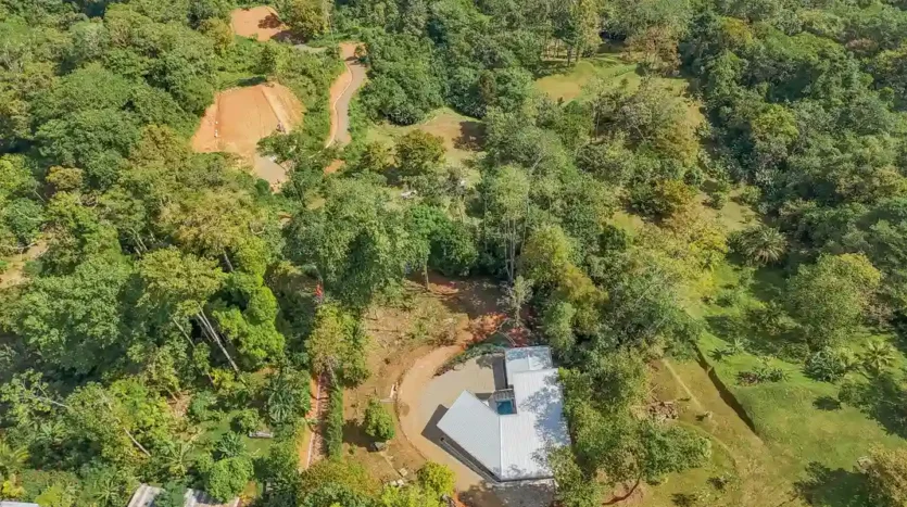 A Unique Rainforest Estate with Two Luxury Homes, River, and Waterfall on 4.93 Acres in Uvita